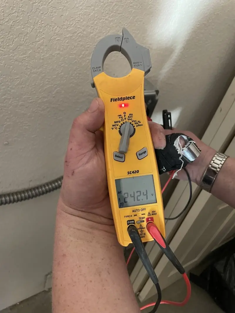Voltage testing with clamp meter during Generator Installation in Alva